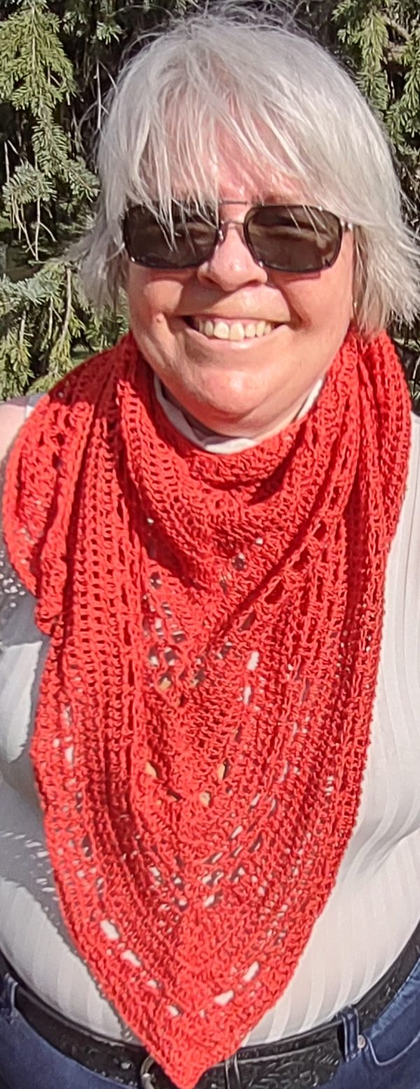 Wearing a shawl as a scarf.